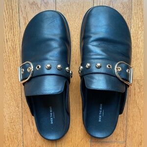 Shoe the Bear leather clogs with shiny gold hardware.